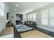 Open living room features a comfortable gray sofa, plantation shutters, and access to dining area at 1075 Bluffhaven Way Northeast Ne Way, Atlanta, GA 30319