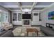 Elegant living room showcases custom built-ins, a fireplace, and a coffered ceiling at 1075 Bluffhaven Way Northeast Ne Way, Atlanta, GA 30319