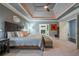 Main bedroom with neutral decor, a tray ceiling, and an attached sitting room at 1075 Bluffhaven Way Northeast Ne Way, Atlanta, GA 30319