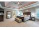 Spacious main bedroom with tray ceilings and a seating area at 1075 Bluffhaven Way Northeast Ne Way, Atlanta, GA 30319
