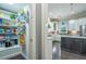 Walk-in pantry is well-stocked with ample shelving, and leads into the kitchen with white cabinetry at 1075 Bluffhaven Way Northeast Ne Way, Atlanta, GA 30319