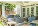 Comfortable outdoor seating and gas fireplace on a covered stone patio create a relaxing outdoor space at 1075 Bluffhaven Way Northeast Ne Way, Atlanta, GA 30319