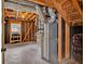 Exposed basement with unfinished walls, exposed pipes and ductwork at 115 Creek Cir, Stockbridge, GA 30281