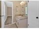 Bathroom features granite countertop, tile floor and neutral paint at 115 Creek Cir, Stockbridge, GA 30281