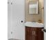 Bathroom featuring vanity with dark wood cabinets, white sink, and modern fixtures at 115 Creek Cir, Stockbridge, GA 30281