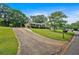 Charming home with a long driveway and well-manicured front yard showcasing great curb appeal at 115 Creek Cir, Stockbridge, GA 30281