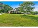 Charming two-story home with a brick and siding facade and a sprawling green lawn on a sunny day at 115 Creek Cir, Stockbridge, GA 30281