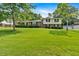 Charming two-story home with a brick and siding facade and a sprawling green lawn on a sunny day at 115 Creek Cir, Stockbridge, GA 30281