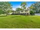 Charming two-story home with a brick and siding facade and a sprawling green lawn on a sunny day at 115 Creek Cir, Stockbridge, GA 30281