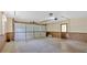 Spacious garage with concrete flooring, wood-paneled walls, and an automatic door at 115 Creek Cir, Stockbridge, GA 30281