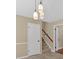 View of stairs and doorway with tile floors and neutral paint at 115 Creek Cir, Stockbridge, GA 30281