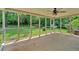 Relaxing screened porch with ceiling fan overlooking the lush, green backyard at 115 Creek Cir, Stockbridge, GA 30281