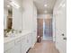 Bathroom with dual sinks, white cabinets, and a tiled glass enclosed shower at 2030 Main Nw St # 205, Atlanta, GA 30318