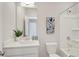 Bright bathroom with a tub-shower combo, white vanity, and modern fixtures at 2030 Main Nw St # 205, Atlanta, GA 30318