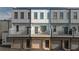 Exterior view of modern townhomes featuring balconies and brick accents at 2030 Main Nw St # 205, Atlanta, GA 30318