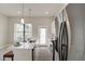 Bright kitchen features an island, stainless steel appliances, and modern fixtures at 2030 Main Nw St # 205, Atlanta, GA 30318