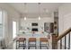 Modern kitchen boasts white cabinets, stainless steel appliances, and a spacious island with seating at 2030 Main Nw St # 205, Atlanta, GA 30318
