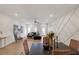 Open living room features recessed lighting, hardwood floors, and geometric accent wall at 2030 Main Nw St # 205, Atlanta, GA 30318
