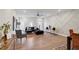Open living room features recessed lighting, hardwood floors, and geometric accent wall at 2030 Main Nw St # 205, Atlanta, GA 30318