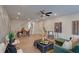 Open-concept living space with hardwood floors, modern furnishings, and ample natural light at 2030 Main Nw St # 205, Atlanta, GA 30318