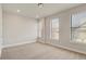 Empty room with carpet and lots of natural light from windows at 2030 Main Nw St # 205, Atlanta, GA 30318