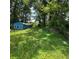 Backyard view with detached structure, illustrating the outdoor living space and lot size at 3547 Pleas Dr, Ellenwood, GA 30294