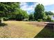Spacious backyard with mature trees and a storage shed at 5 Citation Ct, Ellenwood, GA 30294