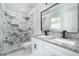 Bathroom boasts double granite vanity, modern fixtures, and marble tiled shower at 5 Citation Ct, Ellenwood, GA 30294