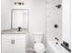 Bathroom boasts modern vanity, fixtures, and marble tiled shower over tub at 5 Citation Ct, Ellenwood, GA 30294