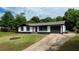 Charming single-story home featuring a well-maintained yard and a long driveway at 5 Citation Ct, Ellenwood, GA 30294