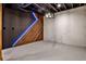 Basement area featuring an accent wall and painted brick wall under modern lighting at 2189 Cedar Forks Dr, Marietta, GA 30062