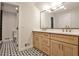 Elegant bathroom with double vanity, modern fixtures, and a stylish tiled shower with glass door at 2189 Cedar Forks Dr, Marietta, GA 30062