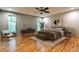 Stylishly furnished bedroom boasting hardwood floors, a ceiling fan, and a serene ambiance at 2189 Cedar Forks Dr, Marietta, GA 30062