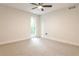 Bright bedroom featuring neutral carpet and a ceiling fan for added comfort, offering ample space at 2189 Cedar Forks Dr, Marietta, GA 30062
