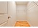 Functional closet with built-in shelving and hardwood floors, offering practical storage space at 2189 Cedar Forks Dr, Marietta, GA 30062