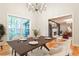 Elegant dining room featuring modern chandelier, large window and hardwood floors at 2189 Cedar Forks Dr, Marietta, GA 30062