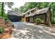 Stunning exterior view of modern home with attached garage and lush landscaping at 2189 Cedar Forks Dr, Marietta, GA 30062