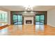 Spacious living room with stone fireplace and sliding doors to screened deck at 2189 Cedar Forks Dr, Marietta, GA 30062