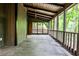 Relaxing screened-in porch with wood flooring and views of the surrounding nature at 2189 Cedar Forks Dr, Marietta, GA 30062