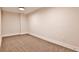 Neutral room with wall-to-wall carpet, baseboard trim, and an overhead light, ready for personalization at 2189 Cedar Forks Dr, Marietta, GA 30062