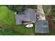 An aerial view of a home, showing a well-maintained yard, driveway, detached garage, and boat storage at 24 Lady Savannah Dr, Dallas, GA 30157