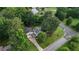 An aerial of a charming home nestled among mature trees, with a garage and well-kept driveway at 24 Lady Savannah Dr, Dallas, GA 30157