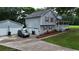 This residence includes a detached garage and a driveway with ample parking space, enhancing convenience for multiple vehicles at 24 Lady Savannah Dr, Dallas, GA 30157
