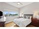 Bright bedroom with a large window overlooking the city and modern furnishings at 4561 Olde Perimeter Way # 806, Dunwoody, GA 30346