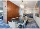 Elegant dining area featuring a large table, booth seating, and modern lighting at 4561 Olde Perimeter Way # 806, Dunwoody, GA 30346