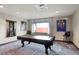 Billiards room with a pool table, stylish decor, and a window offering natural light, great for entertaining guests at 4561 Olde Perimeter Way # 806, Dunwoody, GA 30346