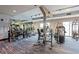 Spacious gym with weight machines, free weights, and mirrored walls for a comprehensive workout experience at 4561 Olde Perimeter Way # 806, Dunwoody, GA 30346