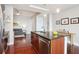 Kitchen with dark cabinets, stainless steel appliances, and an island for seating at 4561 Olde Perimeter Way # 806, Dunwoody, GA 30346