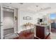 The kitchen features an eat-in island, stainless appliances, and views to the outside balcony at 4561 Olde Perimeter Way # 806, Dunwoody, GA 30346