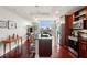A modern kitchen with hardwood floors, a kitchen island, and an open concept living area at 4561 Olde Perimeter Way # 806, Dunwoody, GA 30346